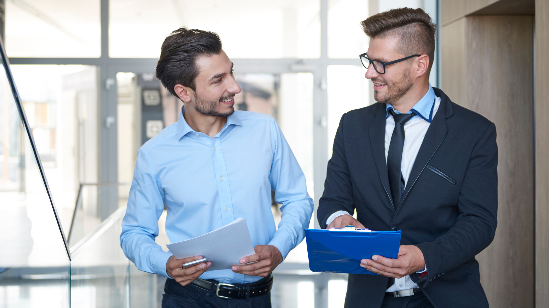Two men reviewing a document