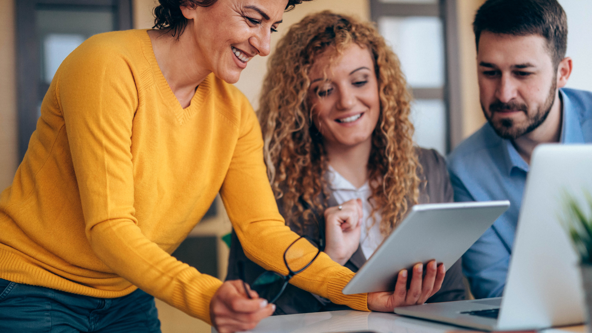 Two colleagues looking at a tablet