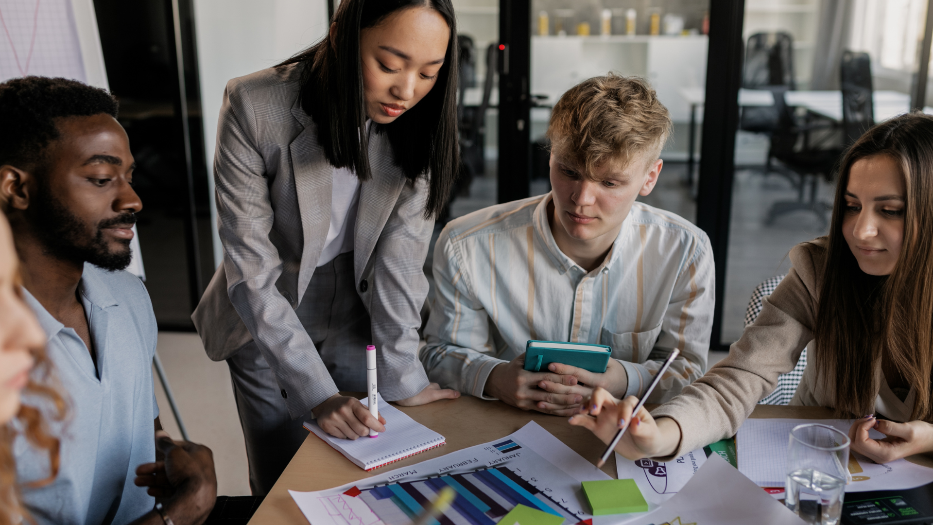 Two colleagues looking at a chart