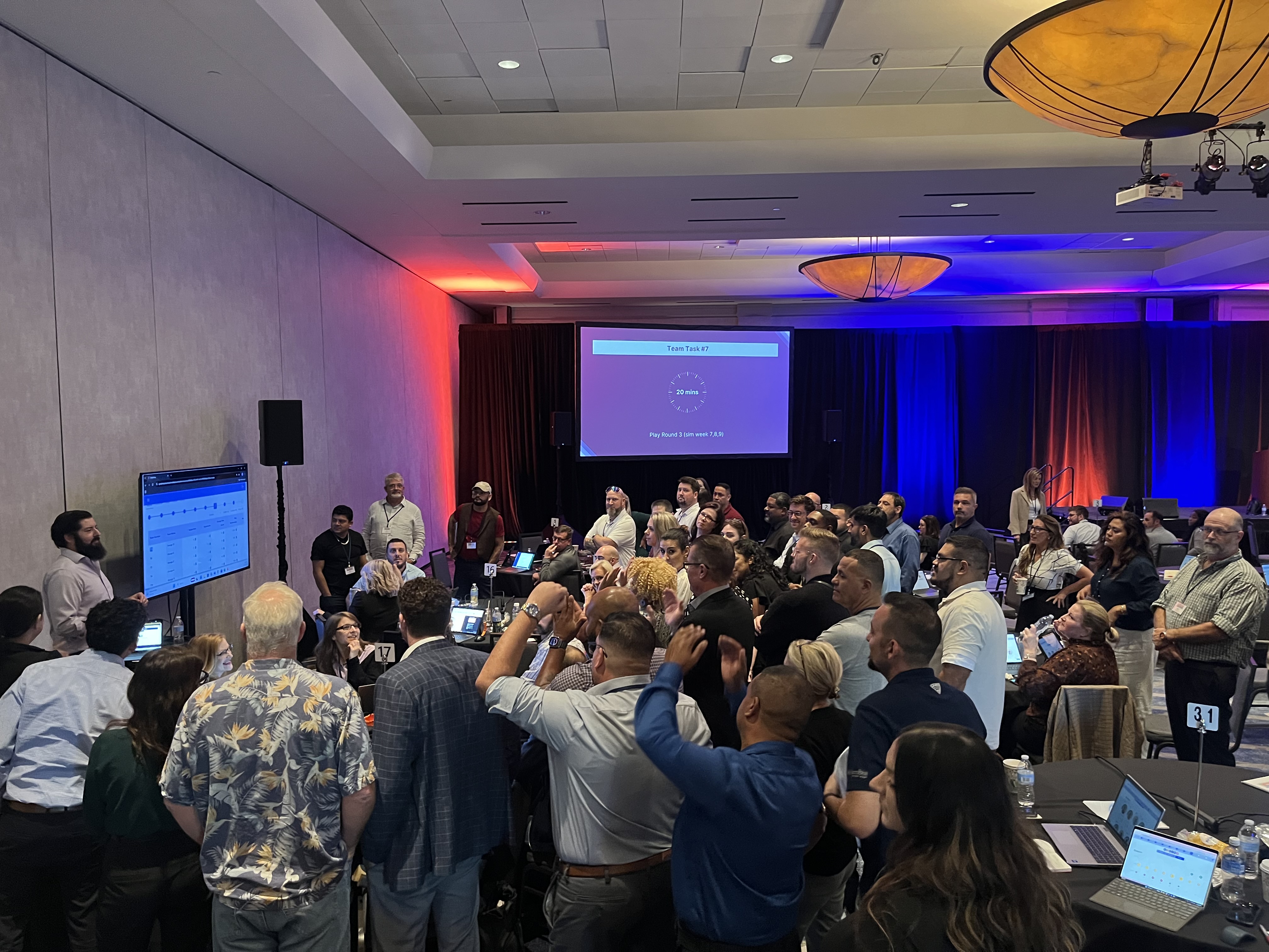 A group of participants around a presentation