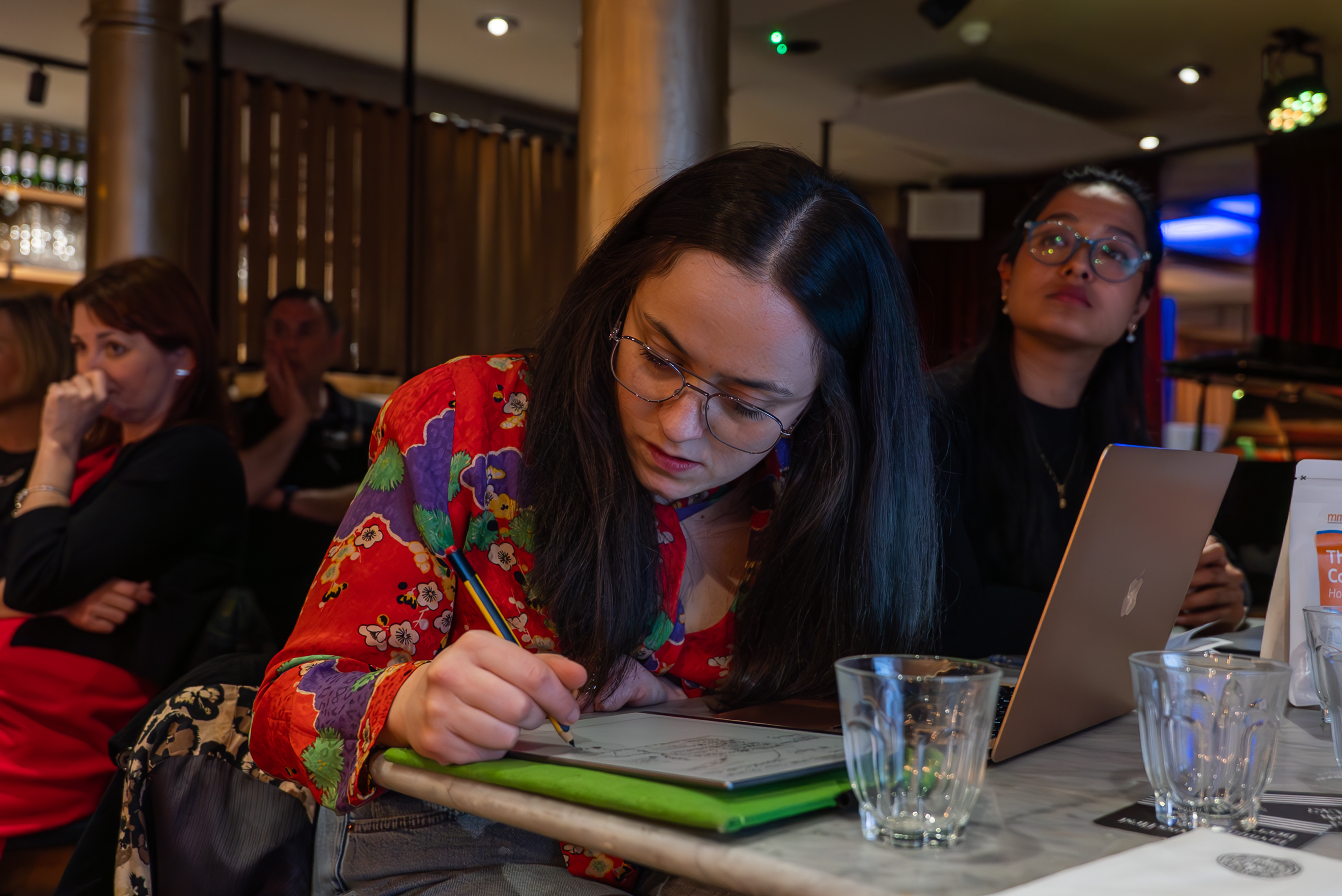 Participant taking notes during a simulation