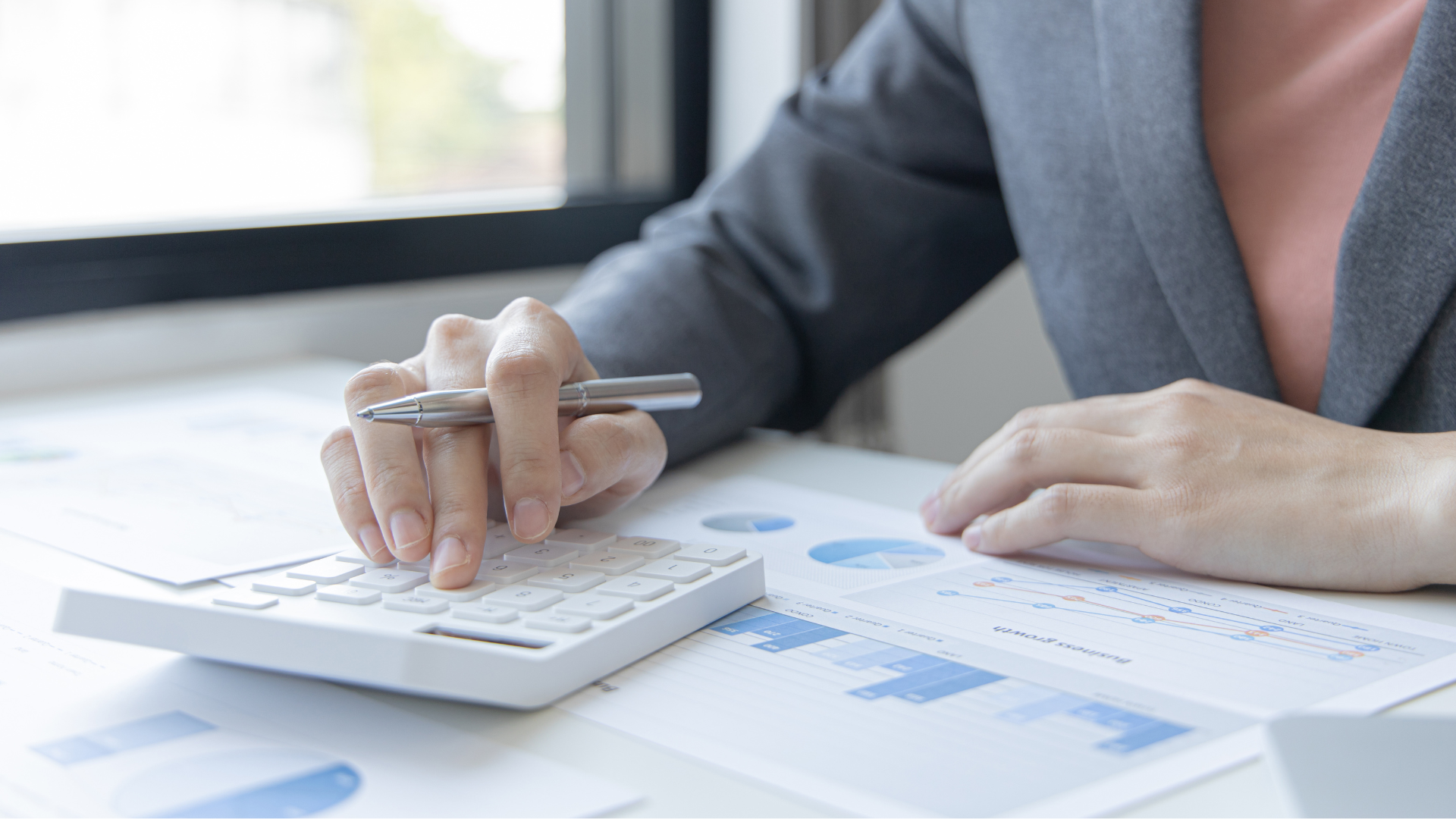 Business person using a calculator